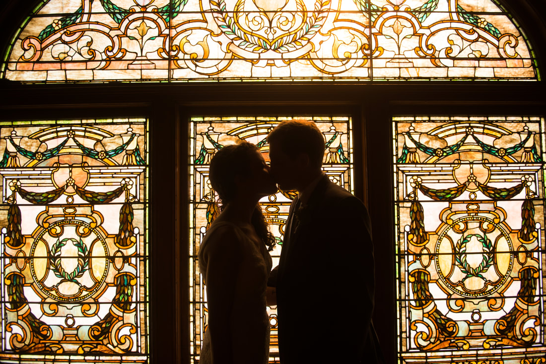 The ceremony took place on a ledge in front of one of The Whitney's stained glass windows.
