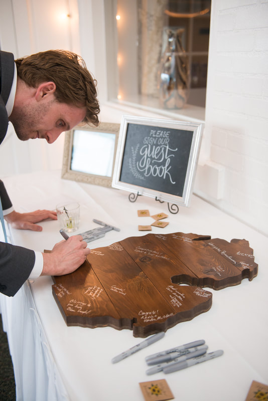 For our guest book, we had guests sign a wood plaque in the shape of the lower peninsula of Michigan.